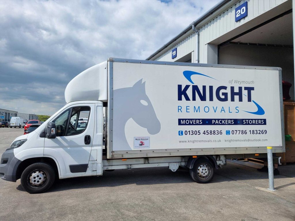 Knight Removals box truck loading outside their Weymouth Unit