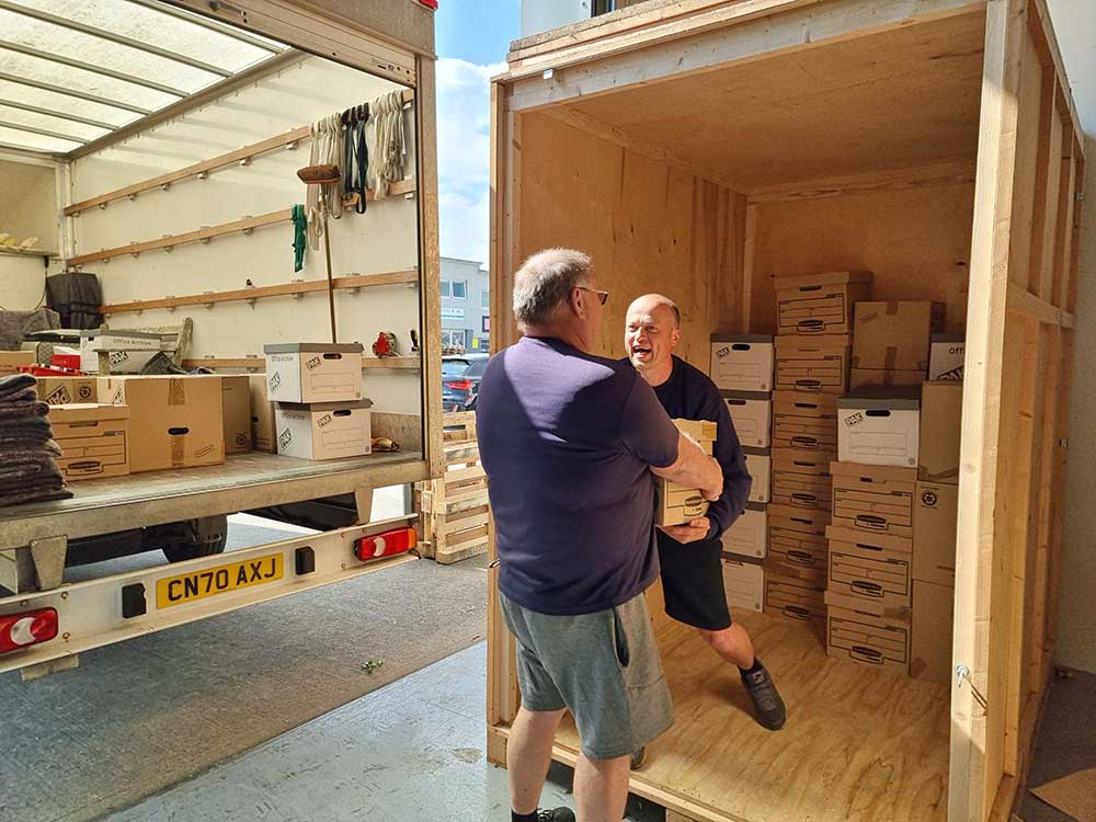 Colin and Ben loading the removals van with boxes
